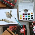 https://www.tintadlaplastykow.pl/gfx/photos/offer_48967867/farby-akwarelowe-talens-art-creation-watercolur-pocket-box-12-half-pans-9022112m_5_1168999911110933.webp
